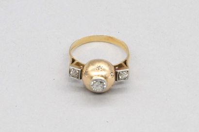 null 
18K (750) yellow gold ring set with a brilliant-cut diamond in the center surrounded...