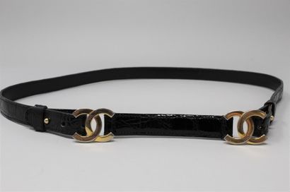 null CHANEL 

Black reptile belt with double buckle with the initials of the brand,...