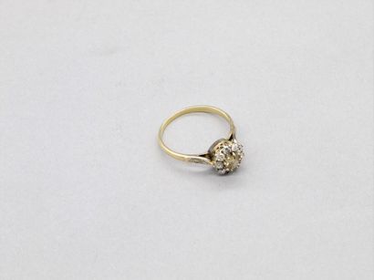 null 18K (750) yellow gold ring set with an old-cut cognac cushion diamond, surrounded...