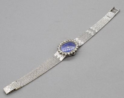 null BOREL 

Montre bracelet de dame en or gris 18K (750). Lunette sertie de brillants....