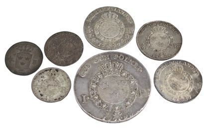 null SUÈDE

Lot de sept monnaies en argent : 

- Adolf Frédérik, 1/8 de Riksdaler...