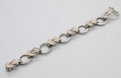 null HERMÈS

Bracelet en argent à maillons articulés alternés nœuds de cordages....