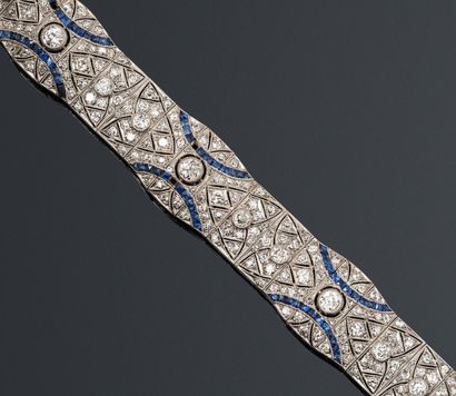 null Bracelet ruban souple en or gris 18K (750) et platine ajouré de motifs navette...