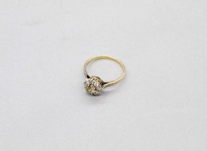 null 18K (750) yellow gold ring set with an old-cut cognac cushion diamond, surrounded...