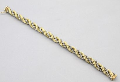 null Bracelet in 18K (750) yellow and white gold with braided mesh, ratchet clasp...