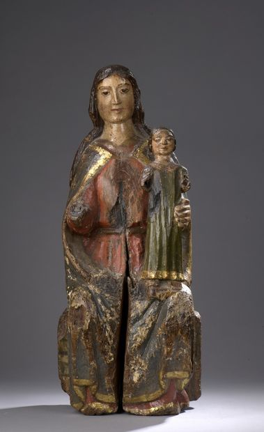 null Vierge à l'Enfant en bois sculpté, polychromé et doré, dos ébauché. Assise sur...