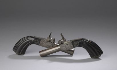 null Pair of percussion handguns. Engraved frames, fluted stocks.

About 1840

B...