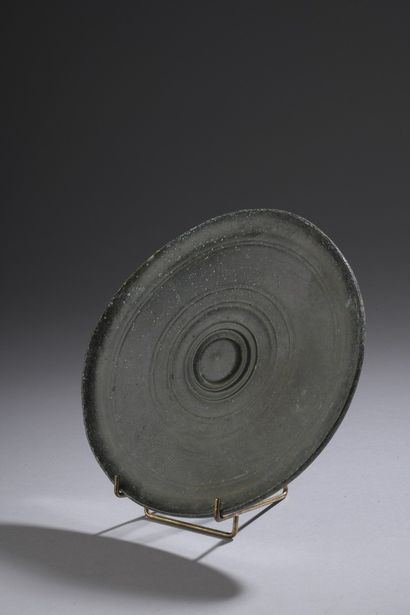 Discoid mirror with omphalos and concentric...