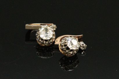 null A pair of 18K (750) silver and gold sleeper earrings, each set with an old-cut...