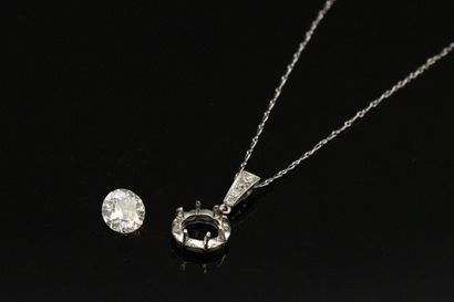 null Pendant in 18K (750) white gold, set with a round old-cut diamond weighing 1.92...