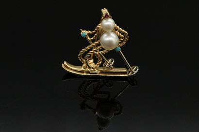 null Brooch in 14K gold wire (585) twisted and smooth drawing a skier, decorated...
