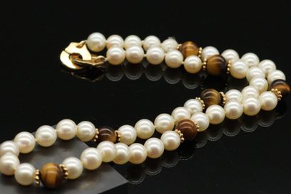 null DINH VAN

Necklace of cultured pearls with tiger eye beads and beaded ferrules...