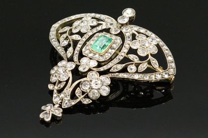 null Silver and gold pendant brooch, set with a rectangular emerald, surrounded by...