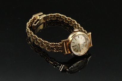 null OMEGA 

Ladies' wristwatch in 18k (750) gold. Round case, back closure pressure....