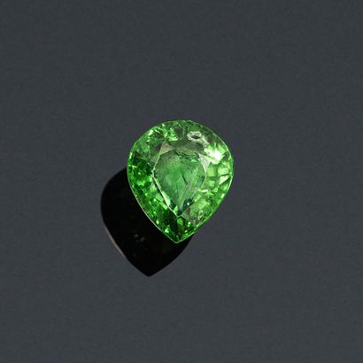 null Garnet tsavorite pear on paper. 

Accompanied by an AIG certificate dated January...