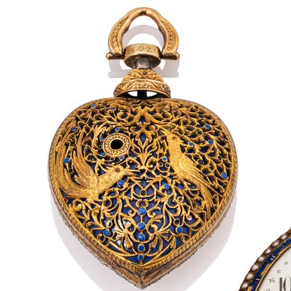 null Watch shaped pomponne, enamel and stones of the Rhine. Case in the shape of...