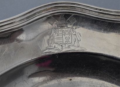 null Round silver dish, with contours and mouldings of nets, engraved later of coats...