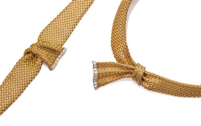 Half set in woven 18K (750) gold comprising:...