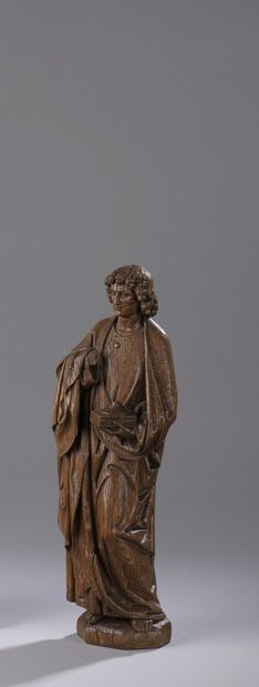 null Saint John in carved oak, back sketched. Standing, he holds a closed book in...