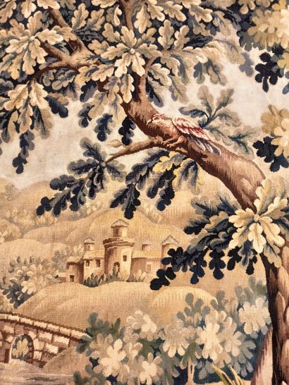 null Green tapestry representing a wooded landscape with two wading birds in the...