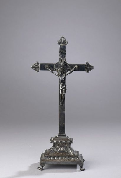Crucifix in cast and chased silver. The ends...