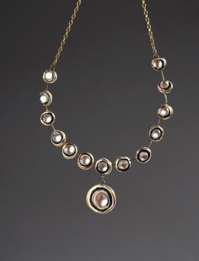 null DC 

Articulated necklace with circular links in painted resin incorporating...