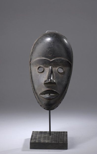DAN - Ivory Coast

Mask with black patina...