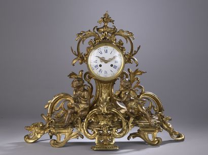 null Gilt bronze clock of form chantournée with decoration of openwork scrolls and...