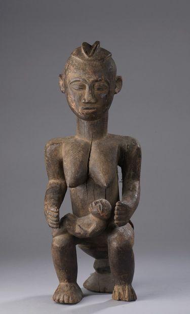 null BAOULE - Ivory Coast 

Motherhood seated on a stool, a child in her arms and...