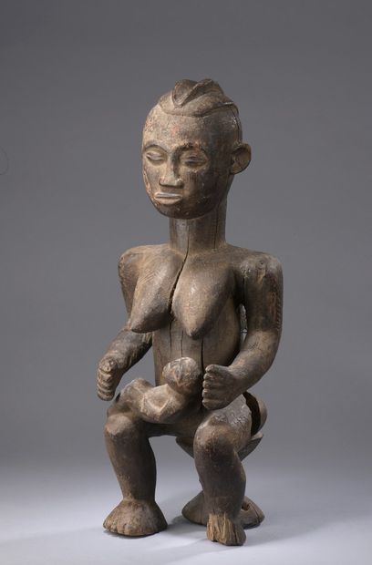 null BAOULE - Ivory Coast 

Motherhood seated on a stool, a child in her arms and...