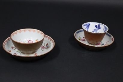 null Two mismatched cups and two saucers with café au lait decoration on the outside...