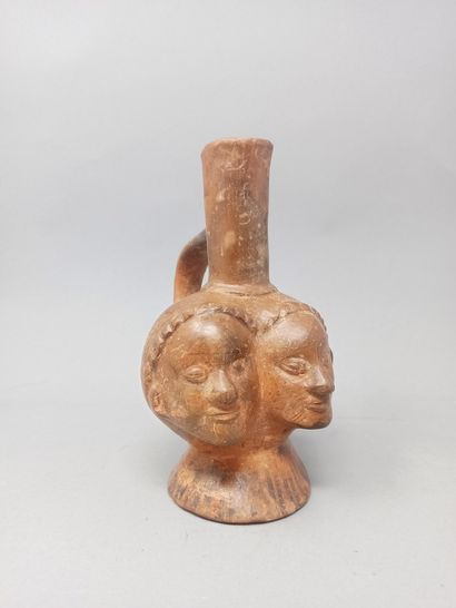 null Vase with long neck in beige and brown terra cotta, the body formed of two Janus,...