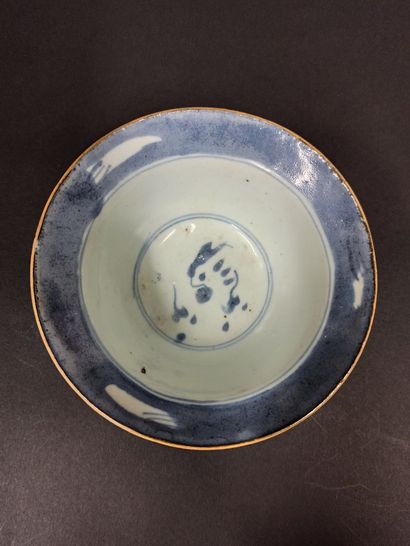 null Meeting of two porcelain bowls, the first one decorated with dragons in clouds...