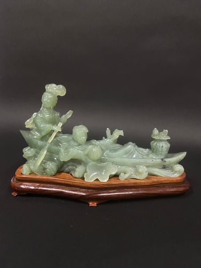 null Group in carved hard stone representing a group of two young women in a boat.

China,...