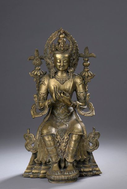 null 
TIBET - Vers 1900
Statuette de Maitreya en laiton, assis à l'européenne, les...