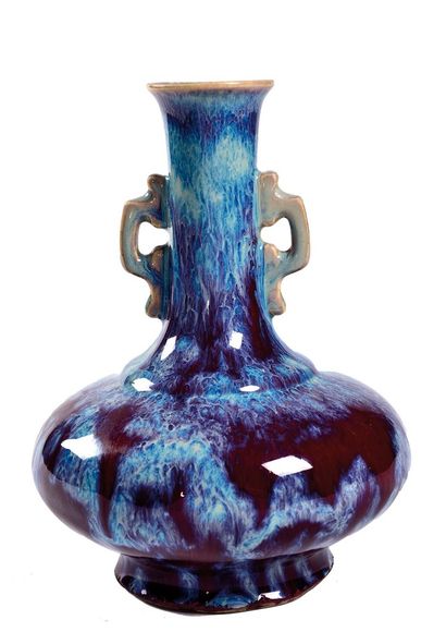  CHINA, 20th century 
Porcelain vase with flamed glaze, the low body, the neck flanked...