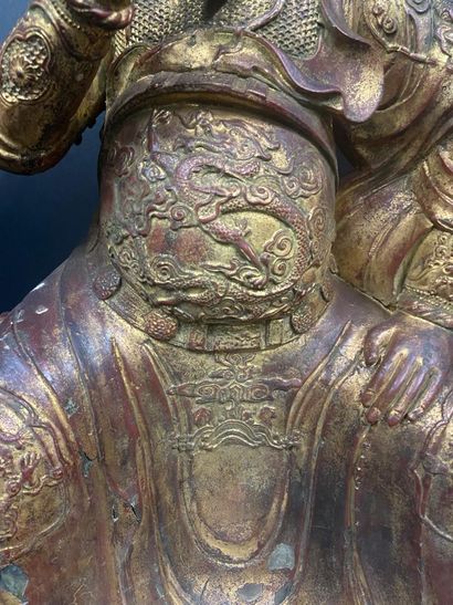 null Important figure in gold lacquered bronze representing a temple guard, his costume...