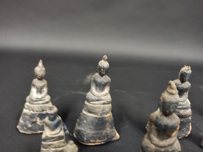 null Suite of 9 Buddhas in terracotta applied with silver leaf and silver gilt

Tibet

H....