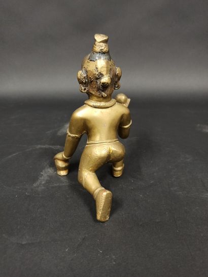 null 
Statuette of KRISNA with a lump of butter in bronze alloy and pigments, the...