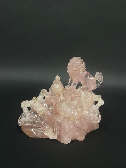 null Group carved in pink quartz representing lions in relief.

China, 20th century

H....