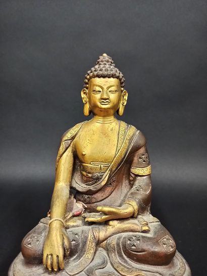 null Buddha in copper alloy represented seated making the gesture of taking the earth...