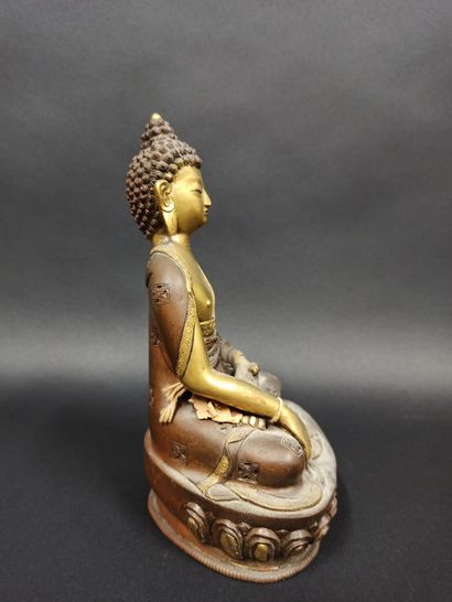 null Buddha in copper alloy represented seated making the gesture of taking the earth...