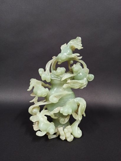 null Covered pot in jadeite with carved decoration of goldfish and waves.

China

H....