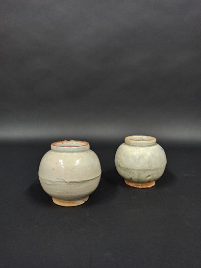 Two ovoid ceramic pots with celadon glaze....