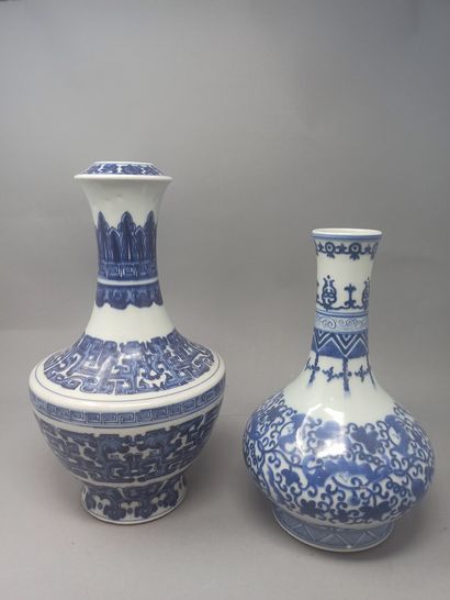 Meeting of two porcelain vases with blue...