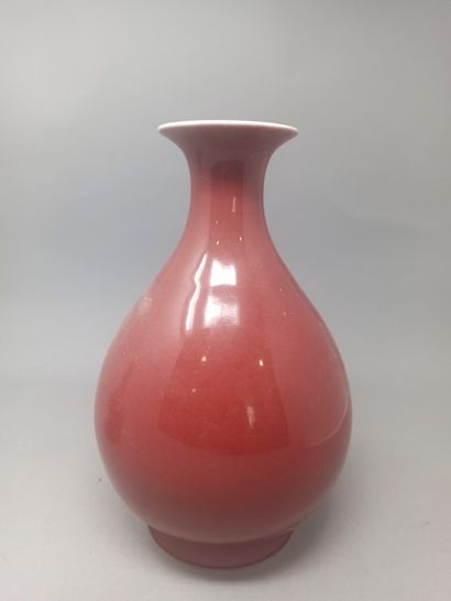  Meeting of two vases, one with an oxblood red background and the other brown. 
Mark...