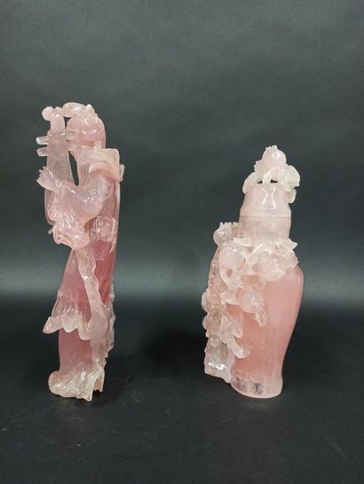 null Meeting of two subjects in carved rose quartz, the first representing a musician,...
