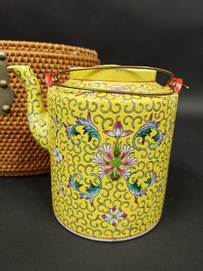 null Porcelain teapot decorated on a yellow background with scrolls and flowers and...