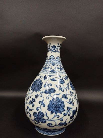  Porcelain vase with blue underglaze decoration of lotus and foliage. 
China 
H....
