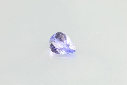 null Tanzanite cushion on paper.

Weight : 1, 62 cts.